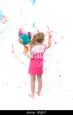 Pretty Little Girl  art student, painting with paint splashes, graphic smears, daubs and smudges. Stock Photo