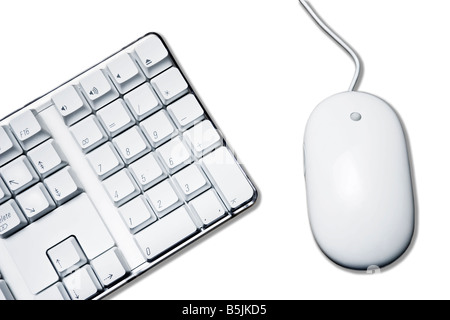 Conceptual picture with white mouse and part of computer keyboard Isolation on white with clipping path Stock Photo