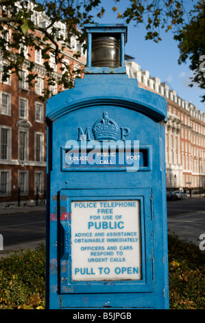 Old blue police telephone post in Grosvenor Square London England UK Stock Photo