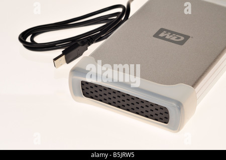 External computer hard drive with USB cable on white background Stock Photo