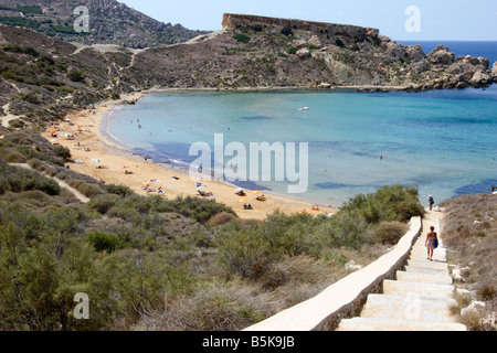 Steps leading down to the beautiful 'golden sandy' beach of 'Ghajn Tuffieha Bay' in northwest Malta. Stock Photo