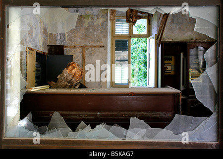 Broken window in an abandoned hotel after the war in Croatia Stock Photo
