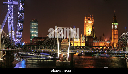 london skyline panorama night time london eye houses of parliament, hungerford footbridge, river thames, night reflections Stock Photo