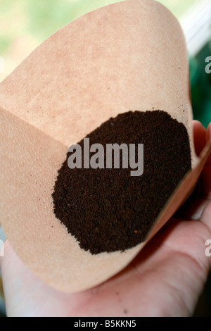 Coffee in natural style unbleached cone coffee filter. Stock Photo