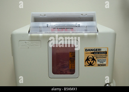 contaminated biohazard receptacle in a medical exam room Stock Photo