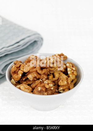 Bowl Of Fresh Healthy Nutritious Walnuts Isolated Against A White Background With No People And A Clipping Path Stock Photo