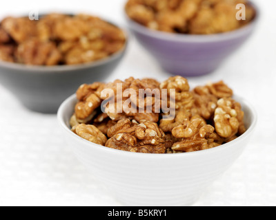 Bowl Of Fresh Healthy Nutritious Walnuts Isolated Against A White Background With No People And A Clipping Path Stock Photo