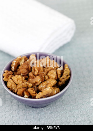 Bowl Of Fresh Healthy Nutritious Walnuts Isolated Against A White Background With No People And A Clipping Path Stock Photo