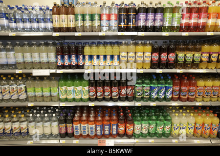 Soft drinks on display in supermarket interior Stock Photo