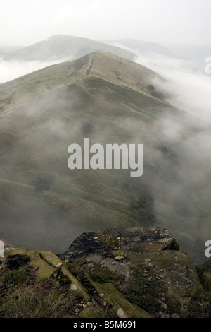 landscape from back tor looking along the mam tor ridge in the english peak district national park with mist and low cloud Stock Photo