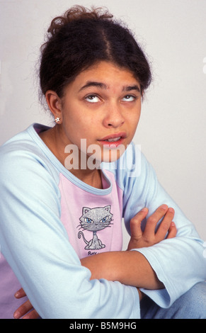 young teenage girl rolling eyes with attitude Stock Photo