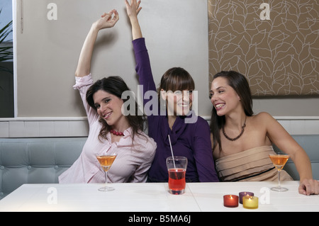 Three women enjoying drinks. Stock Photo