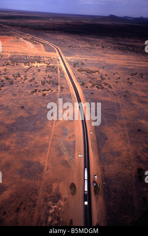 An aerial view looking down on a road train heading south out of Alice Springs on the Stuart Highway Stock Photo