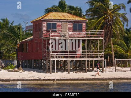 CAYE CAULKER, BELIZE - Wooden house on stilts on the beach Stock Photo