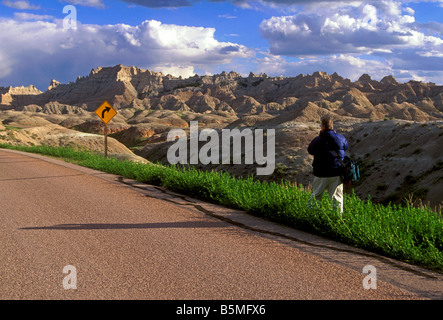 photographer taking photograph, Badlands National Park, South Dakota, United States Stock Photo