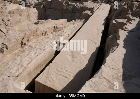 The Unfinished Obelisk in its quarry ordered by Hatshepsut (1508–1458 BC) in the northern region of the stone quarries of ancient Egypt in Aswan Stock Photo