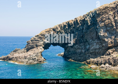 A rock formation still connected to the coast called 'Elephant' beach. Island of Pantelleria, Sicily, Italy. Stock Photo
