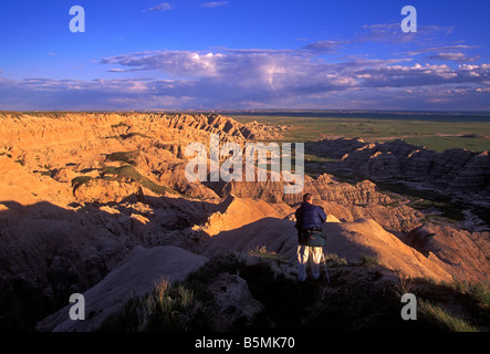 photographer taking photograph in, Badlands National Park, South Dakota, United States Stock Photo