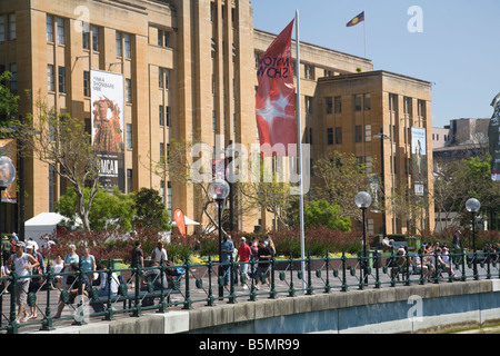 members of the public walk along west circular quay, in front of Sydney's Museum of Contemporary Art,Sydney,Australia Stock Photo