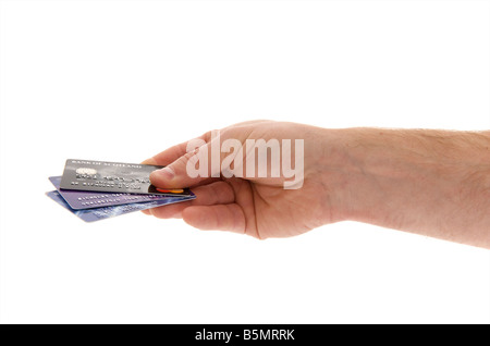mans male right outstretched hand holding a selection of credit cards against a white background Stock Photo