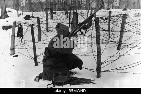 WW1 Russian riflemen firing 1917 Russia World War 1 Russian riflement firing behind a barbed wire fence Photo 21 2 1917 Stock Photo