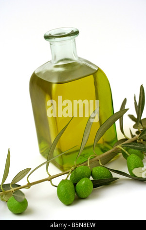 Green olives with leaves and bottles of olive oil Stock Photo - Alamy