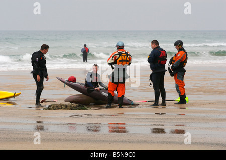 Surf kayakers being instructed at Watergate Bay, near Newquay, north Cornwall Stock Photo