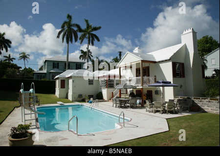 Wide-angle shot of a  large Bemudan house off Pitts Bay Road in Pembroke Parish, showing the garden and swimming pool Stock Photo