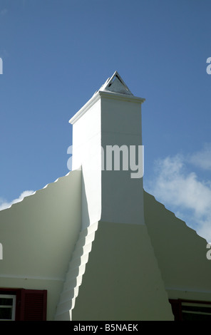 Close-up architectural details of a gable end and stepped chimney on a large Bemudan house off Pitts Bay Road in Pembroke Parish Stock Photo