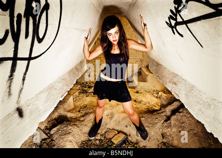 Rebel young girl posing in her hiding place Stock Photo