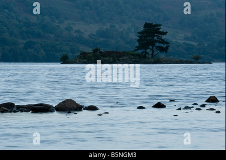 The cold blue light of an Autumn dawn; quintessential Lake District shot of Ullswater with un-named small island. Stock Photo