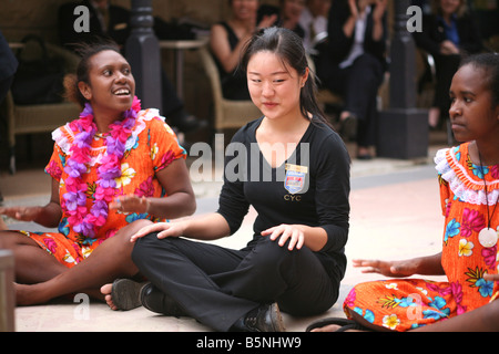 A student at the International School for Hotel Management in Manly Australia learns a cultural dance move Stock Photo