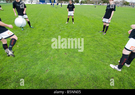Men running doing soccer training drills Stock Photo