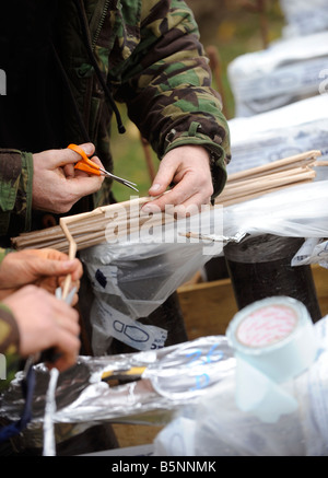 Fireworks being wired up with fuses ready for a public display on bonfire night in East Sussex. Stock Photo