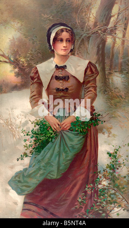 A Fair Puritan - Woman standing in snow, holding holly in her apron Stock Photo