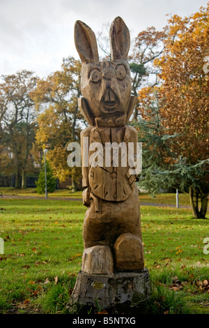 The white rabbit out of Alice in Wonderland, carved out of a tree stump in Edenvilla Park, Portadown Stock Photo