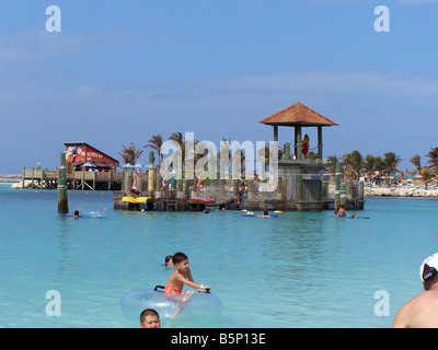 Swimmers at the family beach lagoon at Disney's private island in the Bahamas, Castaway Cay. Stock Photo