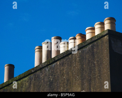 row of chimney pots on edinburgh house Stock Photo