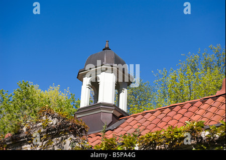 Clay shingles of rooftop in spring against clear blue sky Stock Photo