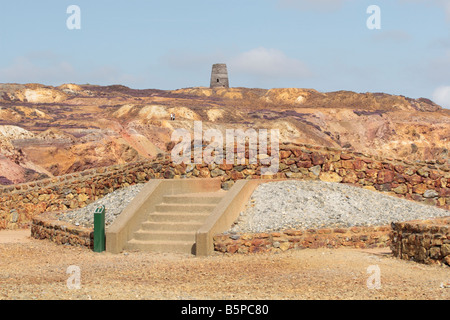 Walking on a path through the remnants of the copper mine on Mynydd Parys mountain near Amlwch, Anglesey, Wales Stock Photo