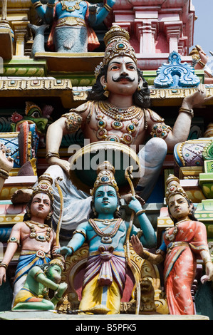 Hindu deities, painted statues, on a temple gopuram in Bangalore. India Stock Photo