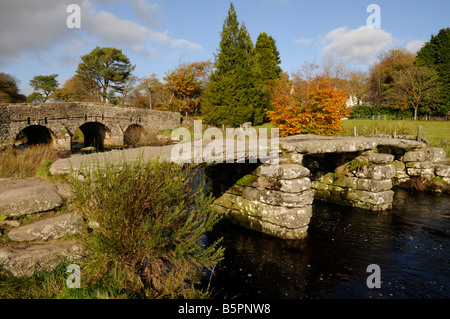 Ancient Clapper bridge across the East Dart River at Two Bridges, Dartmoor, Devon Stock Photo
