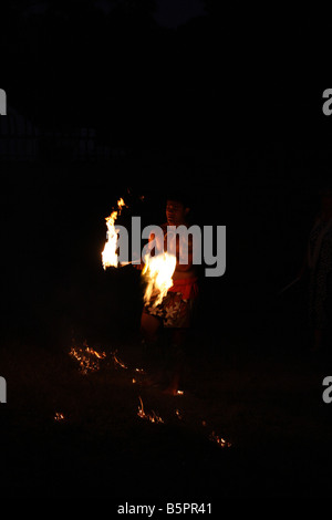 Hawaiian Fire Dancer performing at night Stock Photo