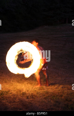 Hawaiian Fire Dancer performing at night Stock Photo