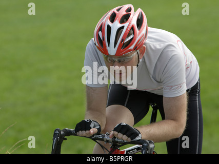 Racing cyclist wearing a helmet Stock Photo