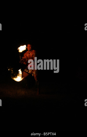 The glow of a Hawaiian Fire Dancer performing at night Stock Photo