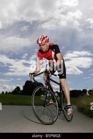 Racing cyclist wearing a helmet Stock Photo