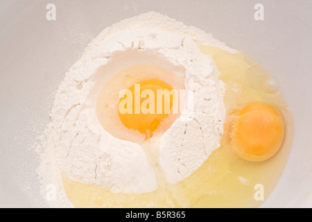 Eggs in flour Stock Photo