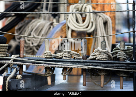 Belaying pins on board the Grand Turk, replica 18th century frigate Stock Photo