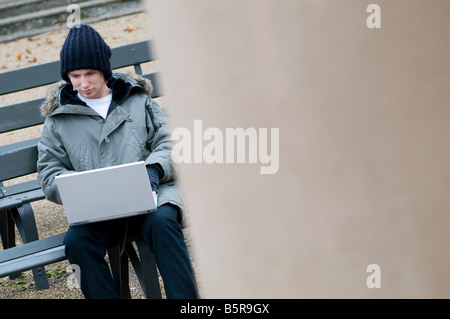 young male using laptop computer Stock Photo